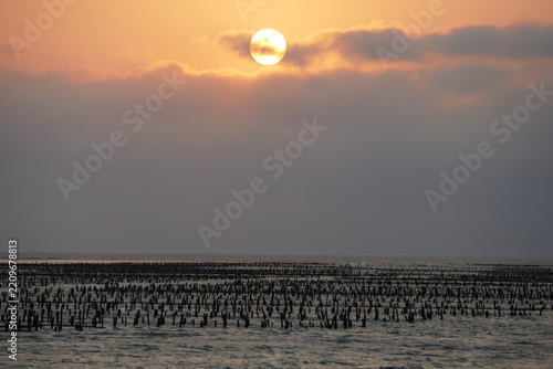 Sunset over an oyster farm at Dongshi Township in Chiayi County, Taiwan