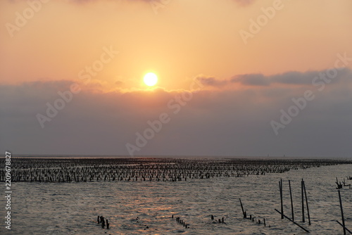 Sunset over an oyster farm at Dongshi Township in Chiayi County, Taiwan