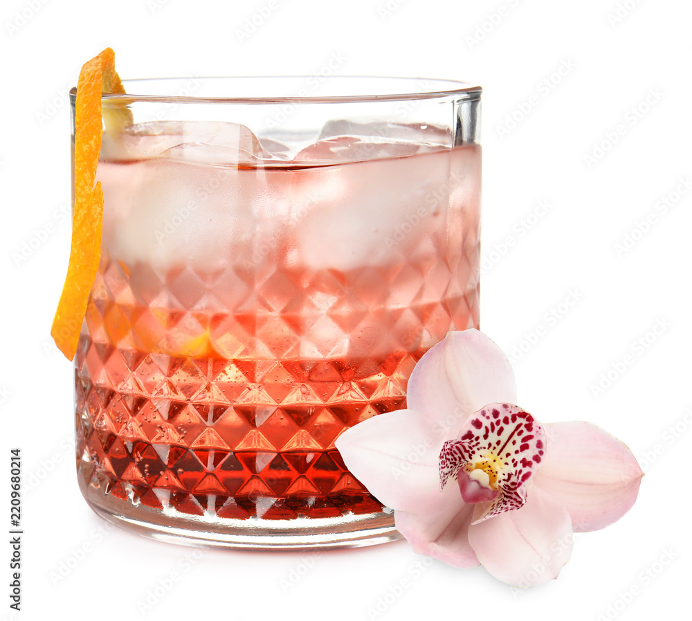 Fototapeta premium Tasty cocktail in glass and orchid flower isolated on white