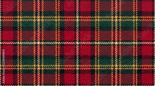 Traditional red and green tartan plaid fabric texture with woven winter holiday wool patterns