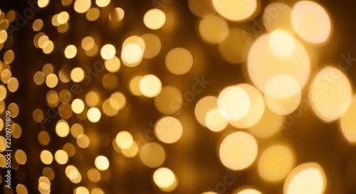 Golden warm bokeh lights glowing on dark background.