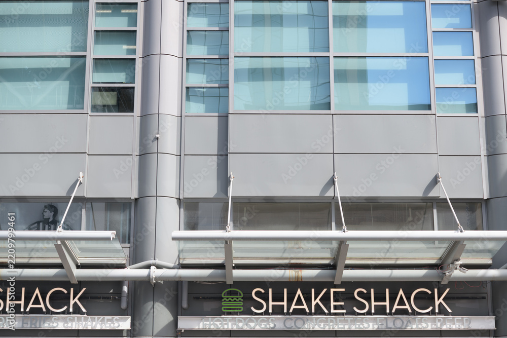 Obraz premium exterior building facade and sign of The Shake Shack, a quick service restaurant chain, located here at The Tenor, a shopping mall, located at 10 Dundas St E, Toronto