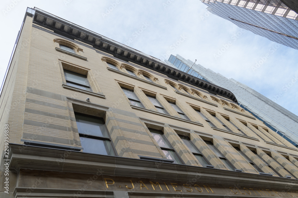 Fototapeta premium exterior of heavily restored Philip Jamieson Building at 2 Queen St W, Toronto (later known as FW Woolworth store)