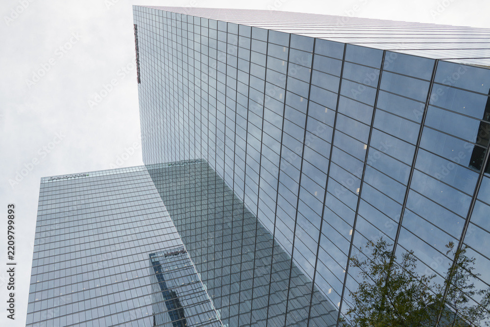 Fototapeta premium an abstract upward view of the Bay Adelaide Centre in the Financial District (Deloitte, Bay Adelaide East tower located at 8 Adelaide St and Scotiabank North Tower, 40 Temperance St, Toronto