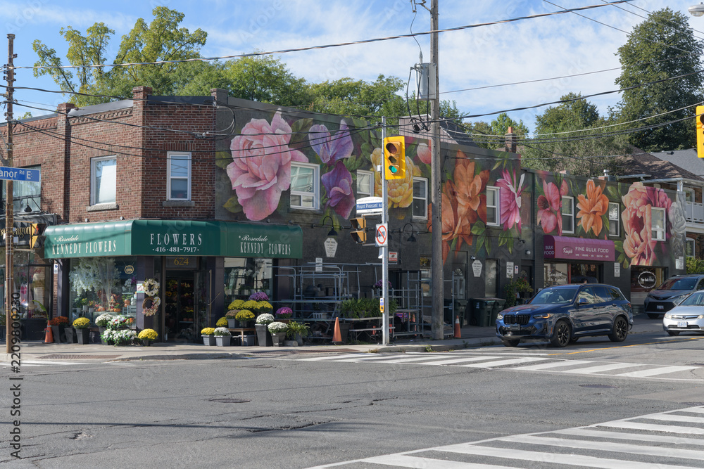 Fototapeta premium wide view of Rosedale Kennedy Flowers, a florist, located at 624 Mount Pleasant Rd, southwest corner of Manor Rd E, Toronto