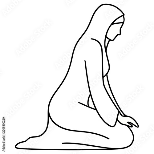 Woman in hijab kneeling in profile
