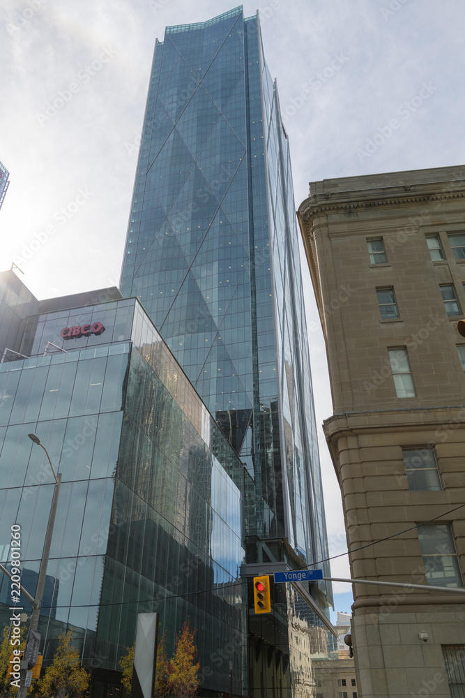Obraz premium another view of CIBC Square (north towers at 141 Bay St) from Yonge St with contrasting historic Dominion Public Building, 1 Front St, Toronto