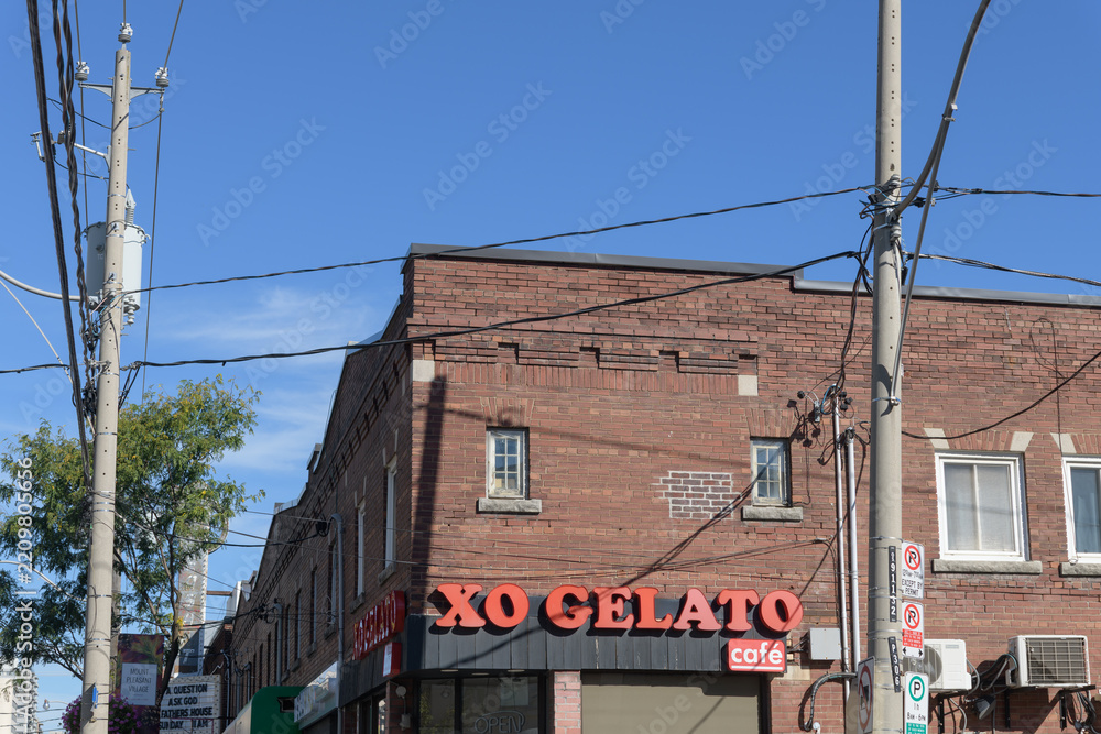 Fototapeta premium wide exterior view of XO Gelato, an ice cream shop, located at 647 Mount Pleasant Rd, Toronto