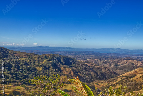 Rolling hills and lakes seen from a distance from the hill top. Costa Rica