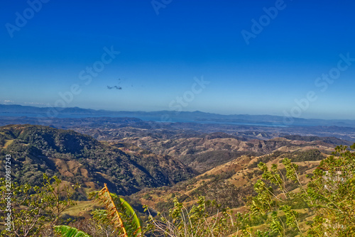 Rugged rolling hills and valleys seen from a scenic point in Costa Rica