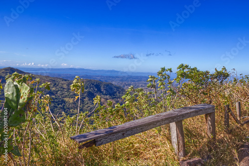 A broken fence overlooking steep valleys and hills - Costa Rica