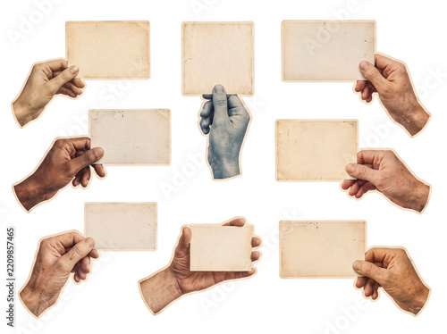 Various hands holding blank vintage cards on clear backdrop