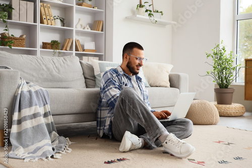 Remote work and digital nomad lifestyle, man using laptop for freelance proje...