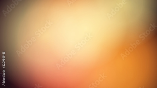 Warm bokeh light leaks transition from dark brown to golden yellow colors.