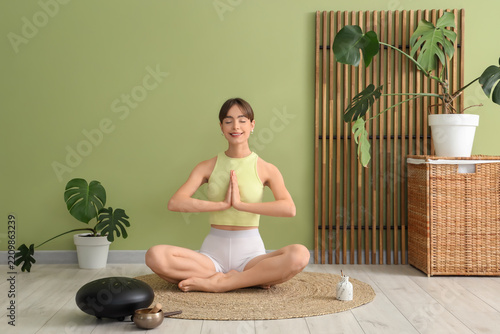 Mindfulness and mental health, young woman practicing yoga and meditation at ...
