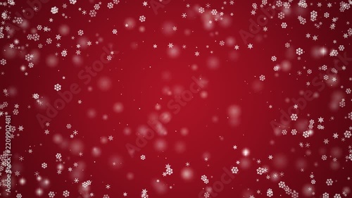 Falling white snowflakes and sparkling bokeh particles drifting gracefully over a festive red gradient background