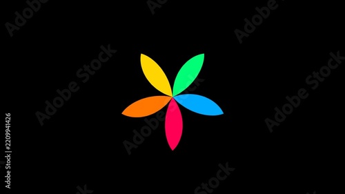 Vibrant colorful petals spinning in circular motion on black background