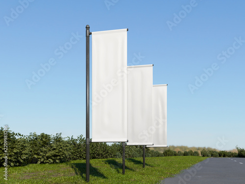 Blank white vertical flag mockup on rural roadside with green landscape