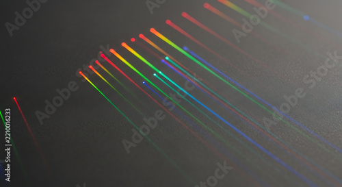 Colorful light refraction rainbow spectrum dark background
