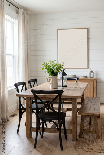 Scandinavian dining room with wooden table and black chairs