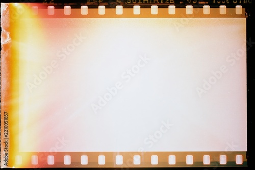 The unexposed film frame with vibrant light leaks and sprocket holes