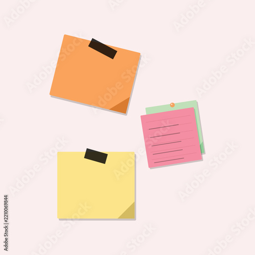 Colorful sticky notes with a paper clip and a binder clip