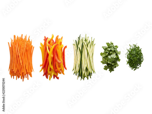Fresh julienne vegetables and herbs arranged for healthy cooking