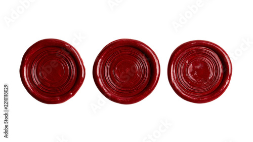 Three round dark red wax seals with concentric circular impressions