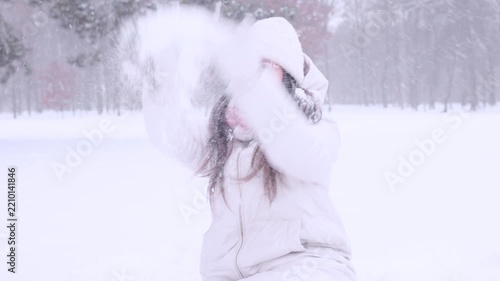 Child winter snow. Toddler playing together with mother outdoors. Happy family concept.