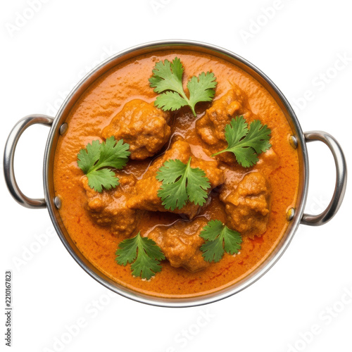 A rich, vibrant Indian curry with tender pieces of meat in a thick orange sauce garnished with fresh cilantro served in a traditional brass tawa bowl against a clean white background