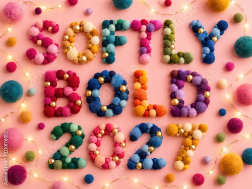 Optimistic New Year 2027 typography in a tactile premium still life with warm texture and clean copy space for festive advertising design