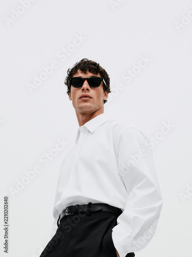 Stylish Man in White Shirt and Sunglasses