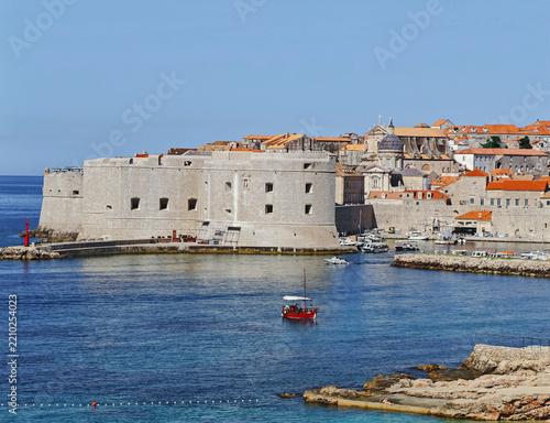 Majestic St. John's Fortress standing proudly by the tranquil blue Adriatic Sea under a clear sky.