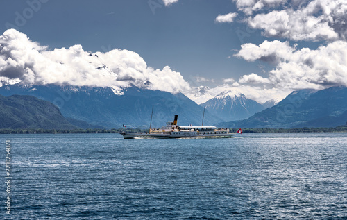 Vintage steamship sailing on Lake Geneva with the Swiss Alps in the background, Montreux, Switzerland