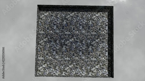 Close-up of gravel surface with water droplets, top-down view