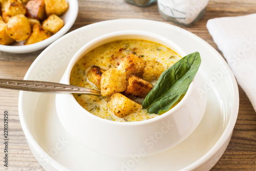 Traditional Turkish winter spinach soup, presented with croutons.