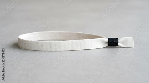 White fabric wristband mockup on neutral background for event branding