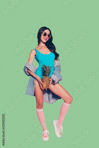 Full length size vertical rest relax carefree careless dreamy glad positive optimist lady she stand isolated on her pink background in style sun glasses shirt with exotic juicy healthy food in hands