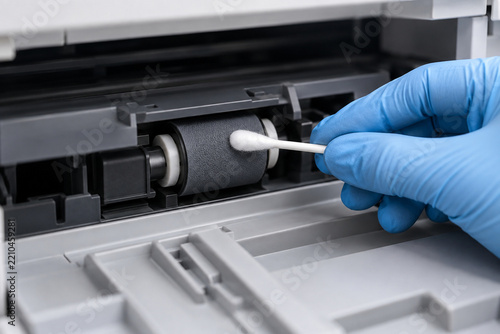 Printer pickup roller cleaned during office maintenance