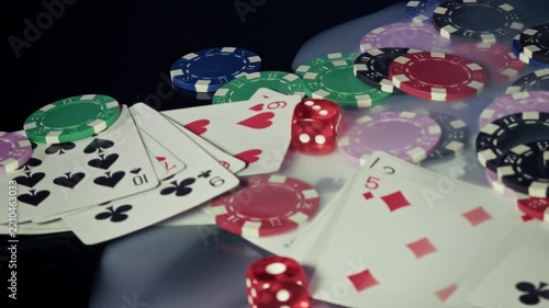 Red Dice and Playing Cards with Casino Chips in Smoke
