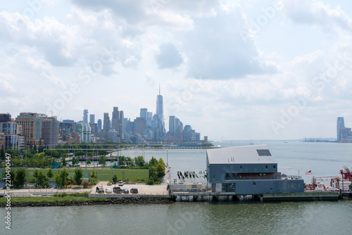 Manhattan skyline from little Island, big fluffy clouds on beautiful summer day in New York City. 