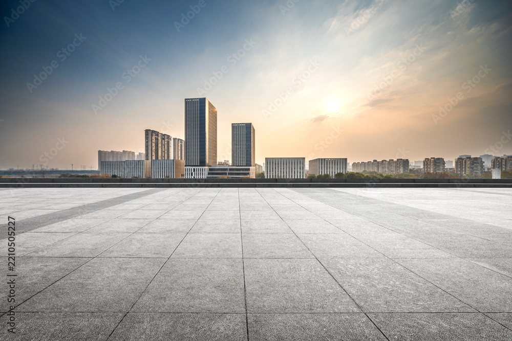 Fototapeta premium Stunning Sunset Over Modern Urban Skyline With Expansive Foreground
