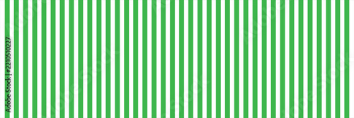 Green and white vertical stripes seamless vector pattern background for carnival, circus, party banner, wrapping paper, fabric print, backdrop, and decorative wallpaper design