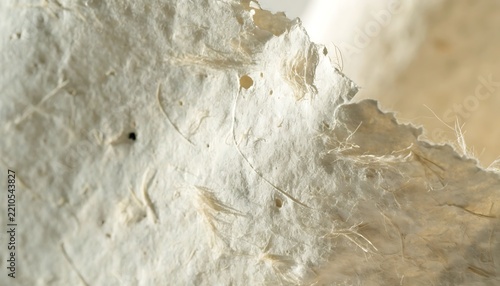 Close up view of a rough textured white stone wall surface with natural cracks and weathered details