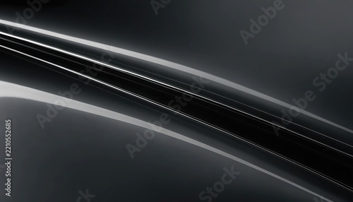 Abstract background featuring smooth flowing dark curves and soft light reflections creating a modern minimalist aesthetic