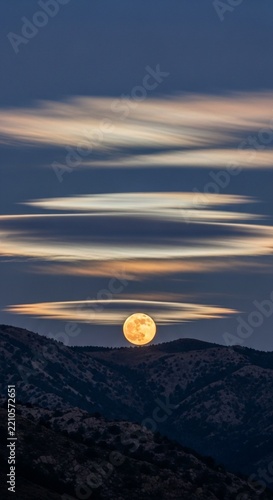 Thin Clouds Illuminated by the Radiant Light of a Rising Full Moon