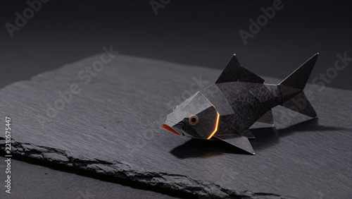 Modern dark mode papercraft koi fish with neon orange accents