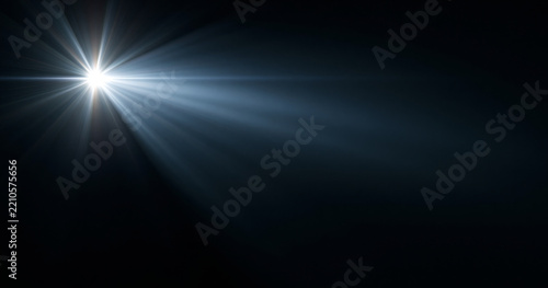 Bright white light beam in darkness
