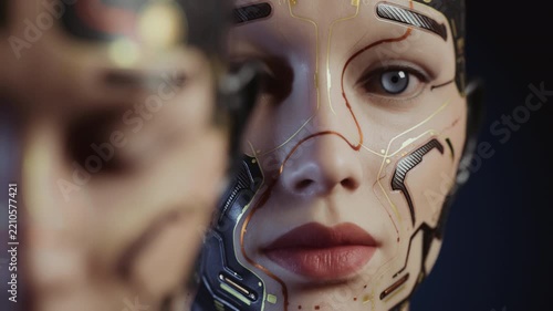 Focus shifts between two awakening female androids.