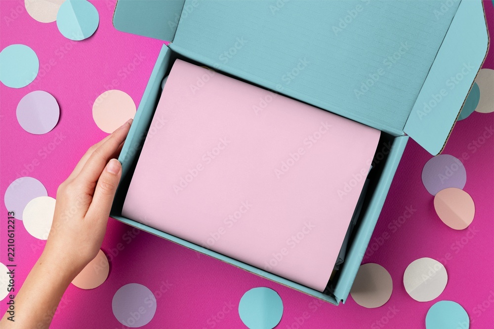 Fototapeta premium Pastel gift box with pink card on confetti background